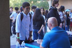 Student and PDS Health staff talking
