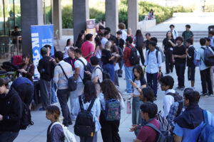 Large crowd of students lining up for the Industry Showcase booths